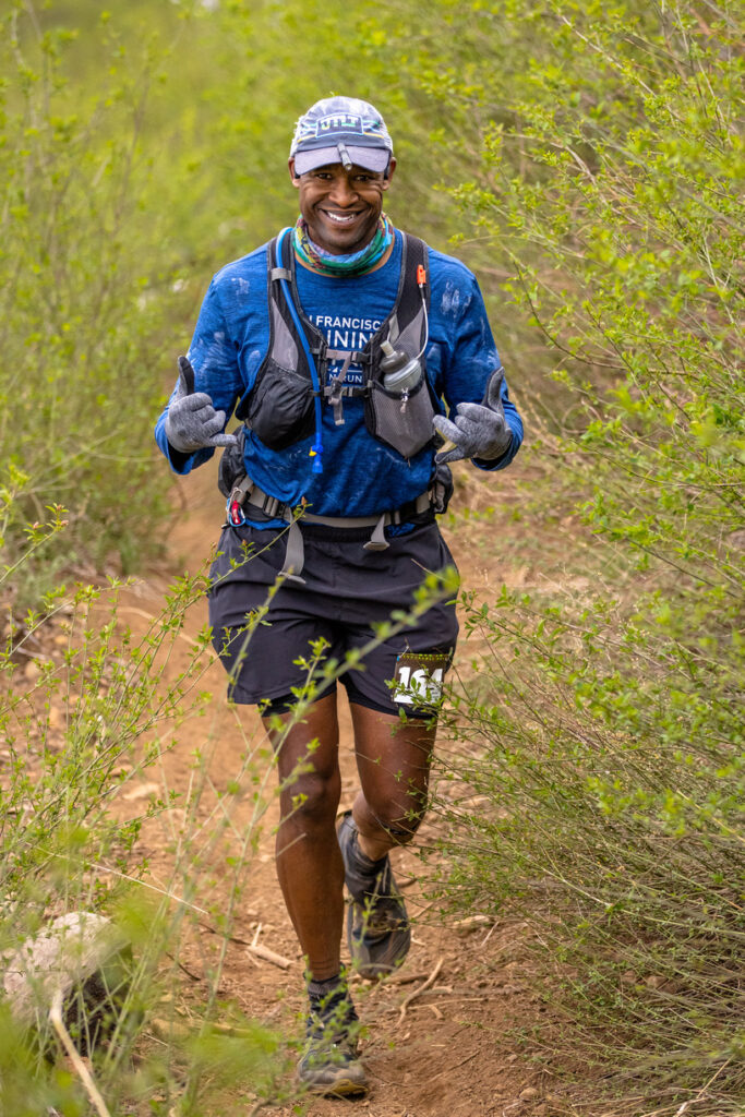 a person running on a trail