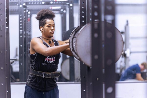 student in weight room