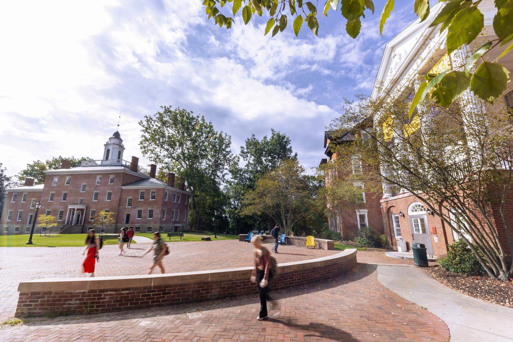 a group of students walking in a courtyard