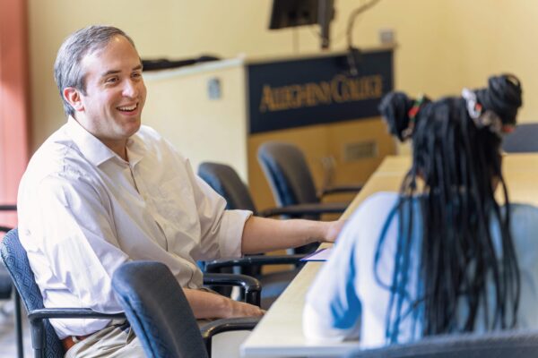 Admissions counselor speaking with a student