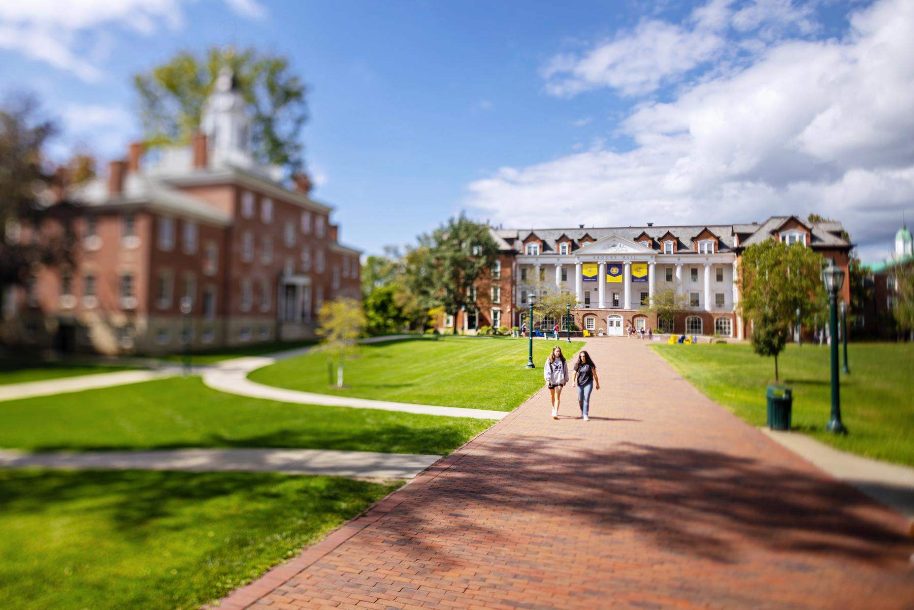 Photo of two students walking on campus