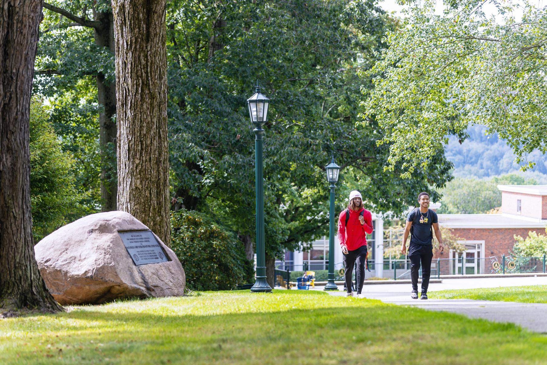 two students walking on campus