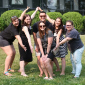 Six people standing on a hill posing