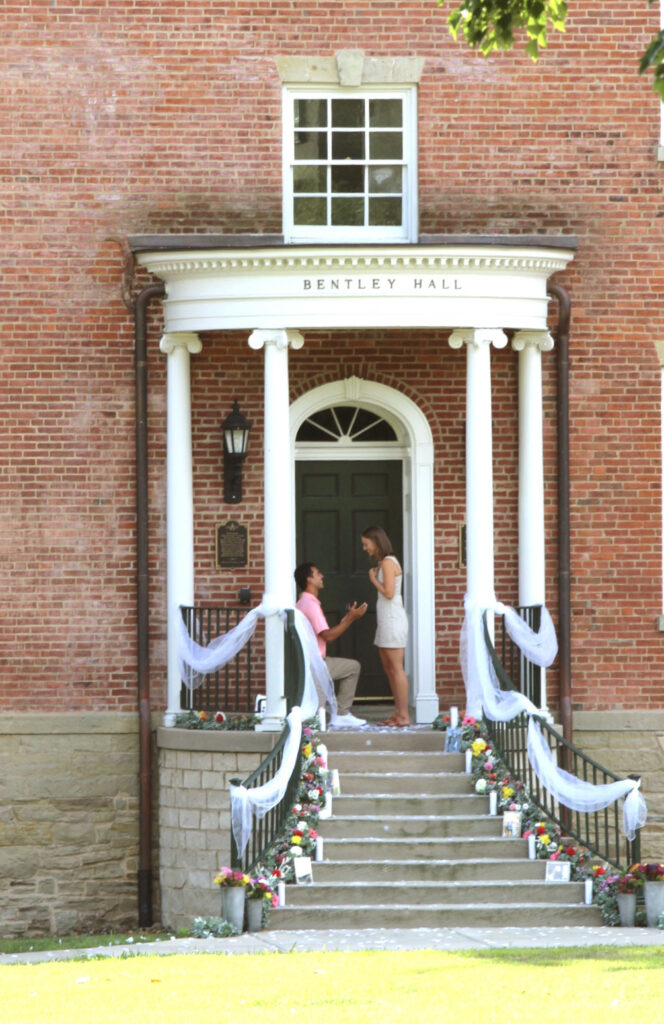 a couple standing in front of a building