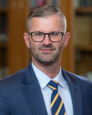 portrait of a person in a suit and tie
