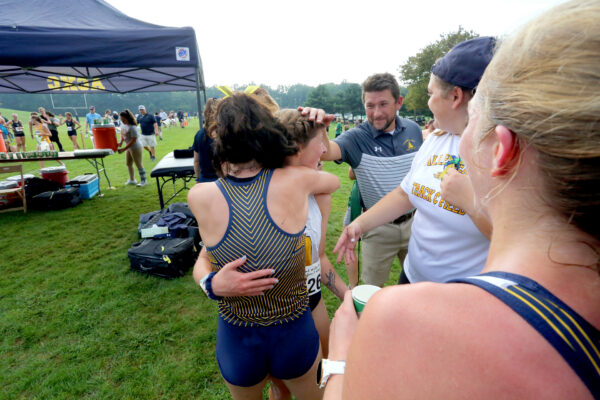 Ben Mourer (coach) with team members after a competition 