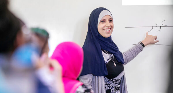 a person in a headscarf smiling