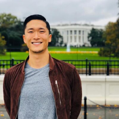 a person standing in front of the white house