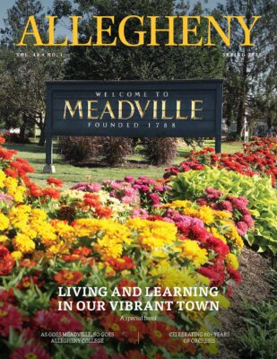 Spring 2025 Magazine Cover. Flowers and a sign.
