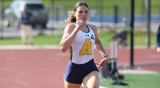 a student athlete running on a track