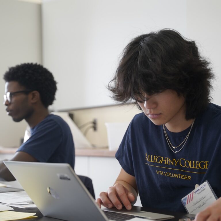 Allegheny College students work on laptops as part of the Center for Business and Economics VITA Internship program