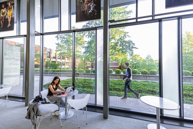 Girl sitting in the windows of Vucovich