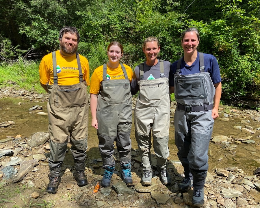 Research Scientist Mark, Meredith Barney '21, Casey Bradshaw-Wilson, and Kelly Pearce pose during a research outing in French Creek in Crawford County, Pennsylvania.