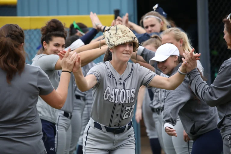 Women's softball celebrating.