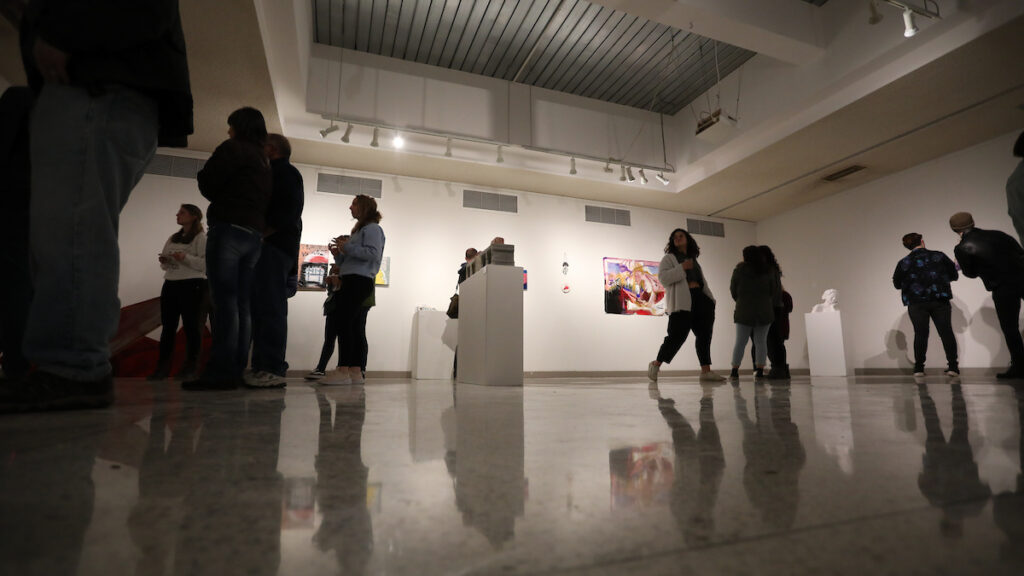 a group of people in an art gallery