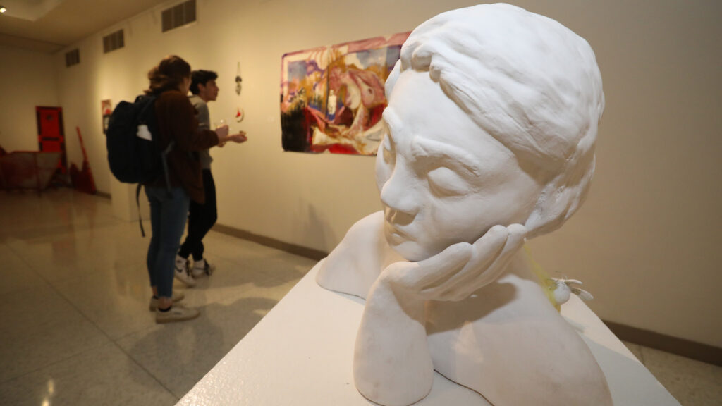 a white statue of a person