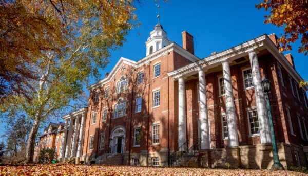 a brick building with white columns