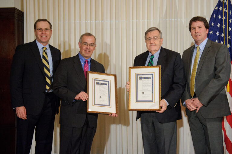 Jim Mullen, Mark Shields, David Brooks, and Dan Shea post together, the center two holding their framed prize certificates