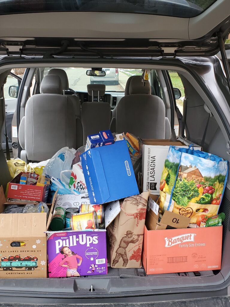 a car with a trunk full of boxes