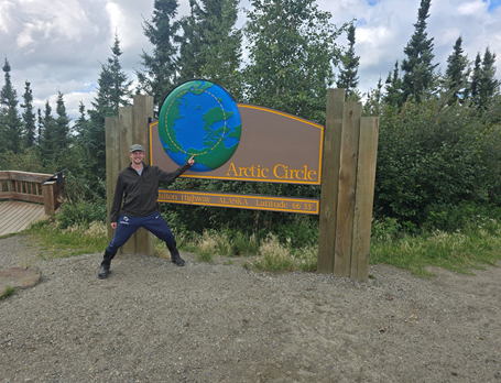 Owen Werkeiser ‘26 in front of sign