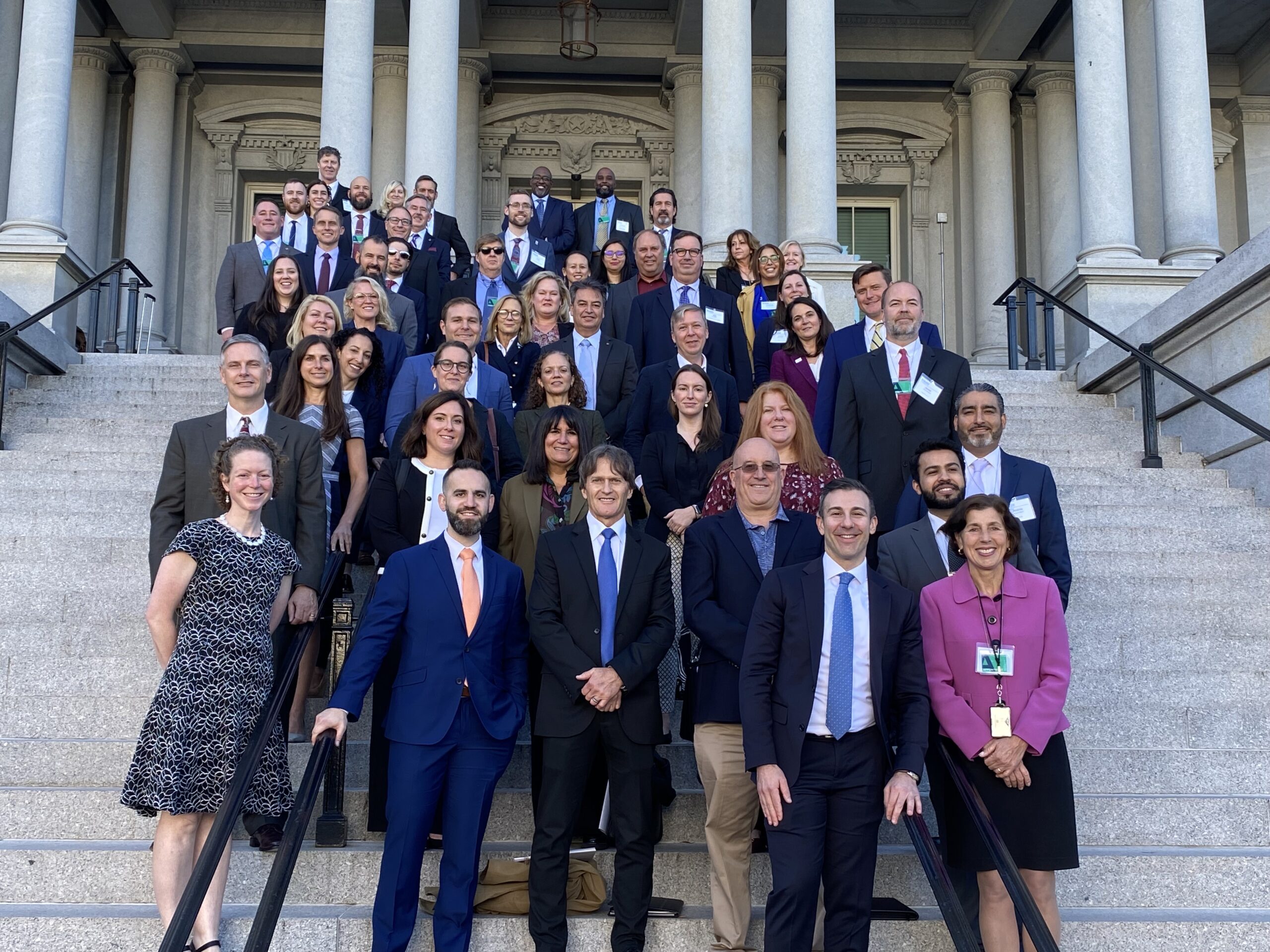 Photo is of all participants of Better Buildings Initiative gathering on the Navy Steps of the White House campus. Participants include Department of Energy staffers and representatives from many sectors nationally - manufacturing, retail, housing, education, government.