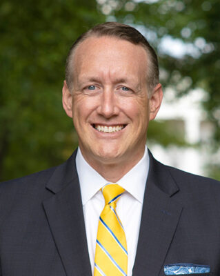 portrait of a person in a suit and tie