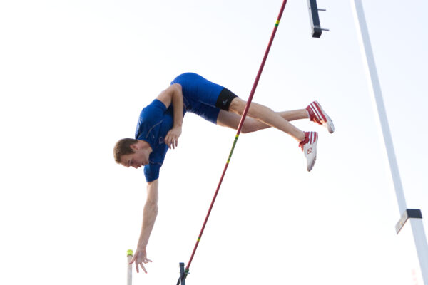 Pole Vaulter Jeremy Scott going over the horizontal bar