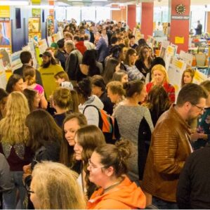 a group of students in a crowded room