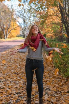 a person throwing leaves in the air